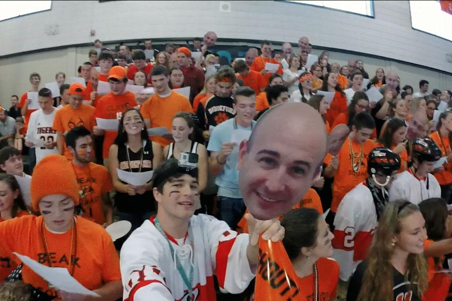 Evan Loignon sings along with his class at the 2014 Homecoming Rally